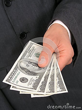 Businessmanâ€™s Hand Offering Money Stock Photo